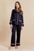 Hera Womens Black Satin Pyjamas - Model Front | Bown of London